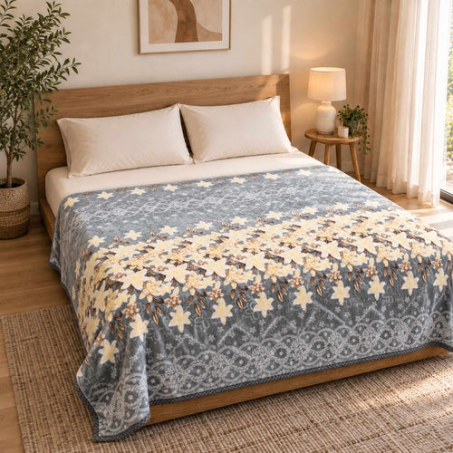 Grey / Yellow Lily Garden Cloudy Velvet Blanket displayed on a double bed