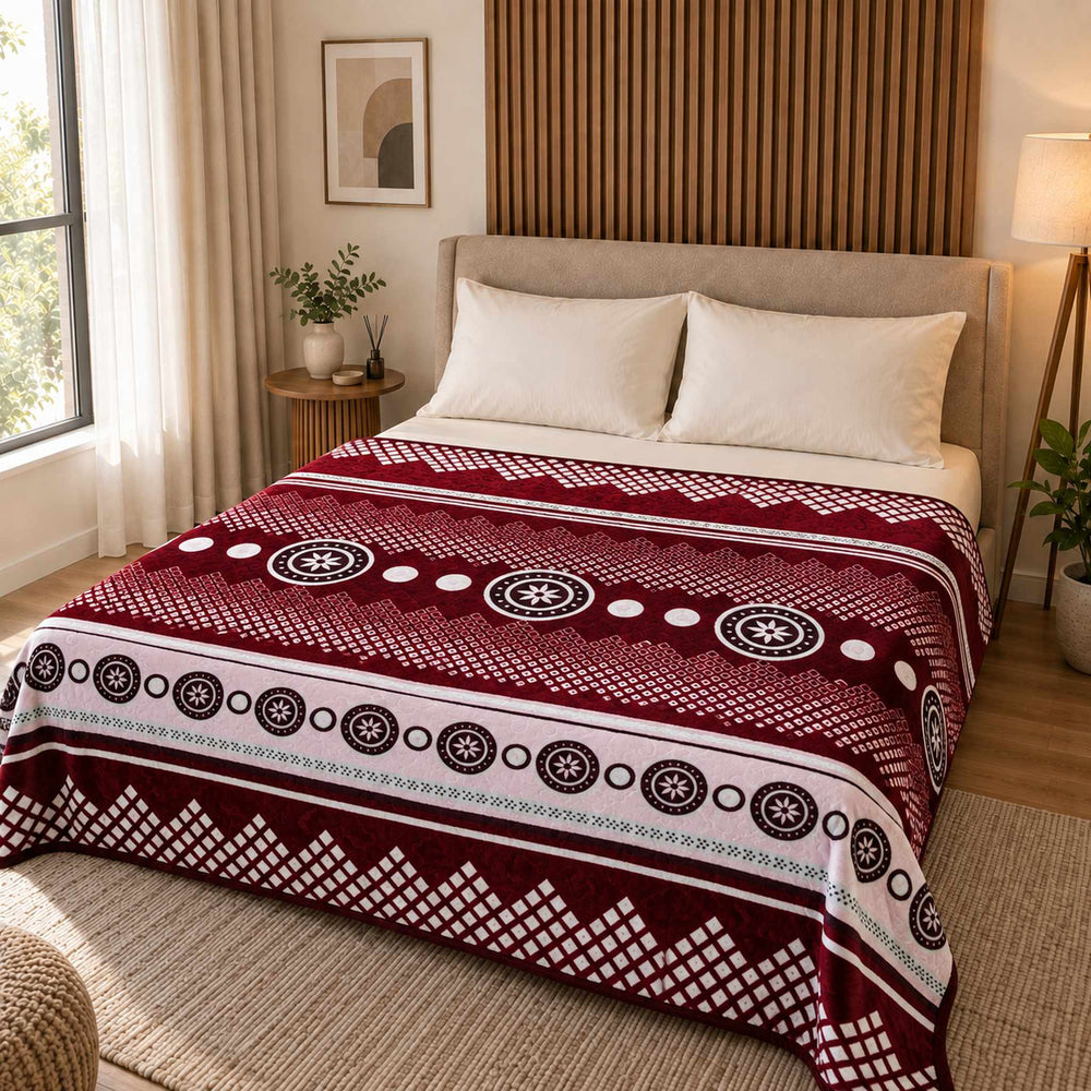 Burgundy / White Circular Geometric Stripe Cloudy Velvet Blanket displayed on a double bed