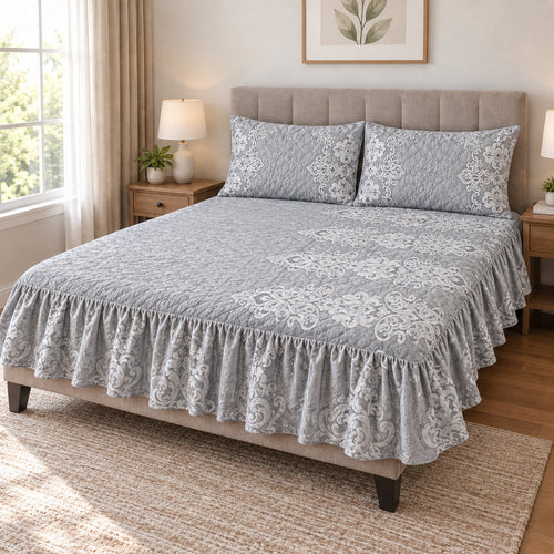 Silver Grey Plachi damask velvet bedsheet set with frill on a king-size bed with 2 matching quilted pillow covers