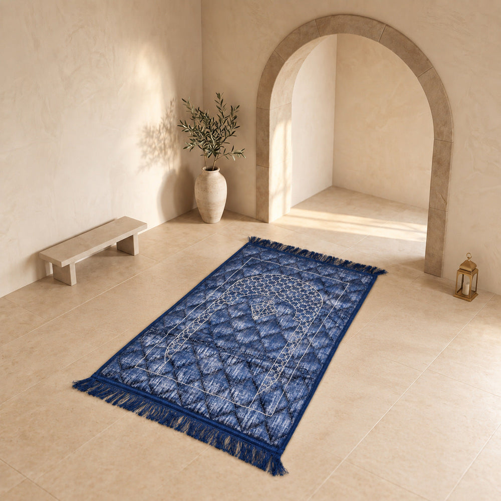 Royal Blue textured velvet prayer mat (janamaz) with embroidered lattice mihrab on a stone floor